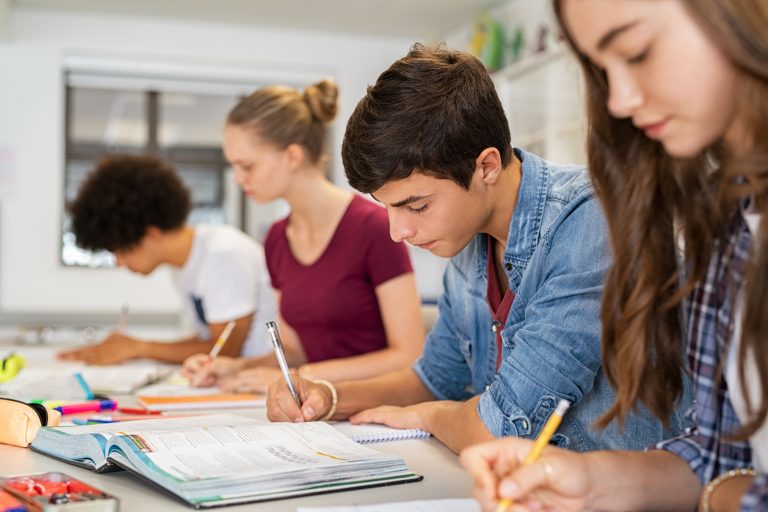 5 Skills - High school students doing exam in classroom